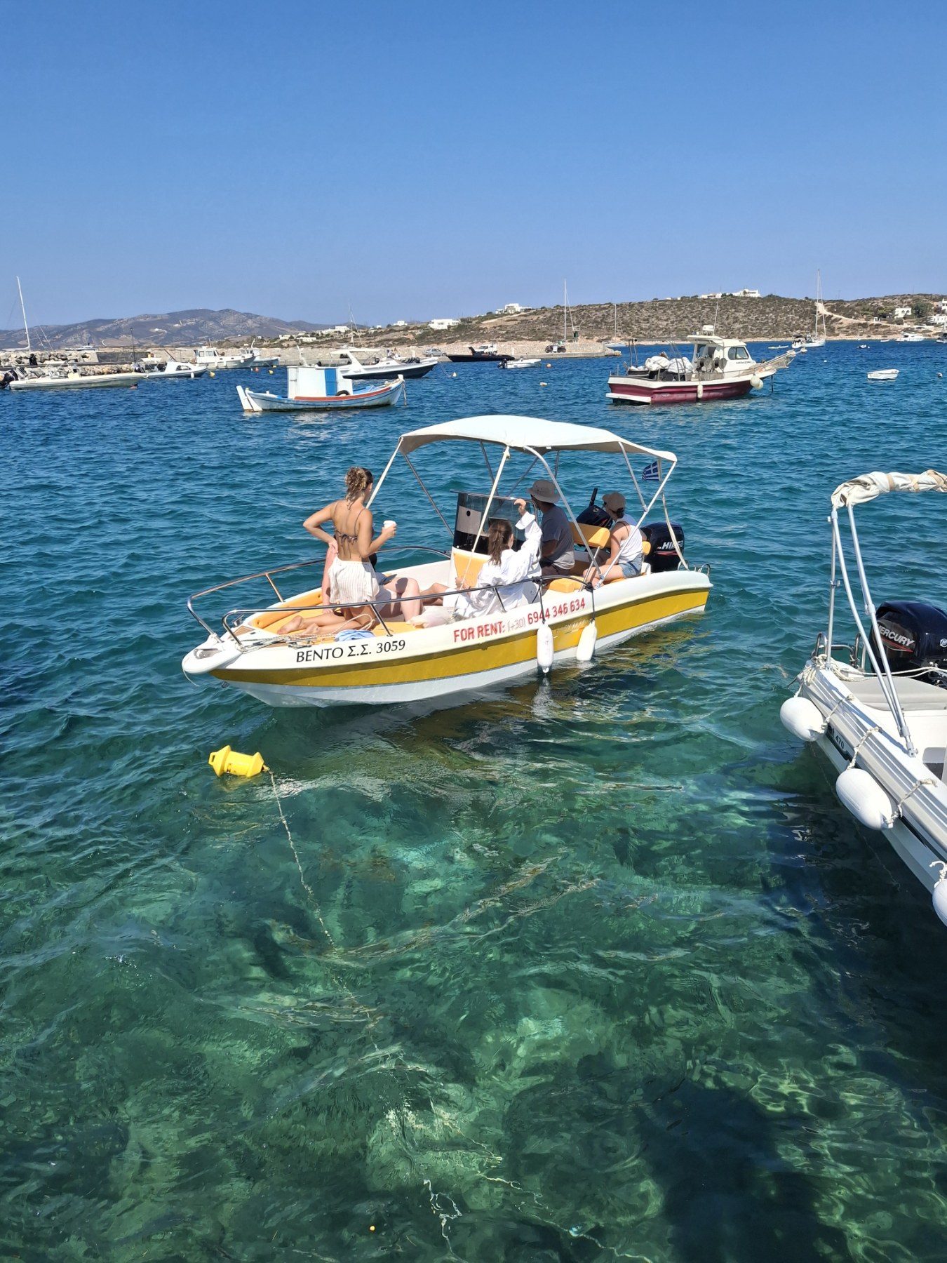 Bento at anchor in a turquoise bay of Paros