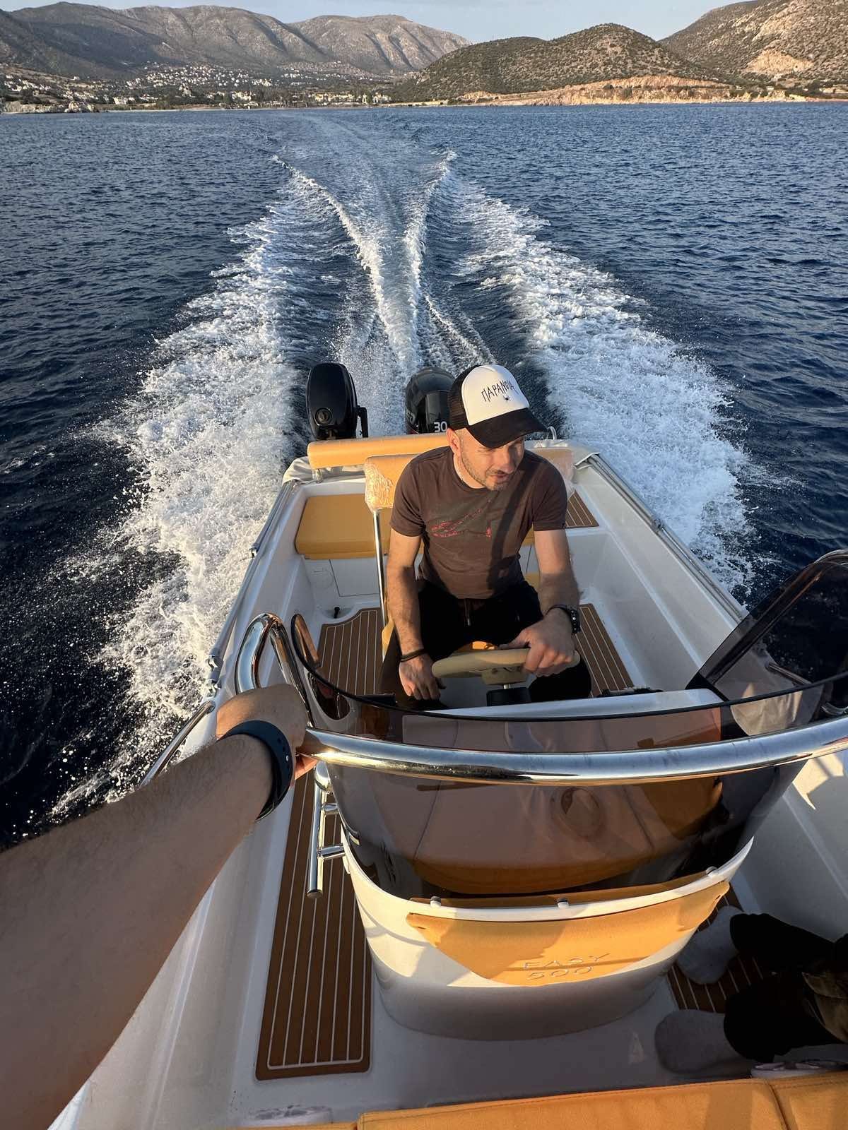 Our captain at the helm on the way out of Alyki